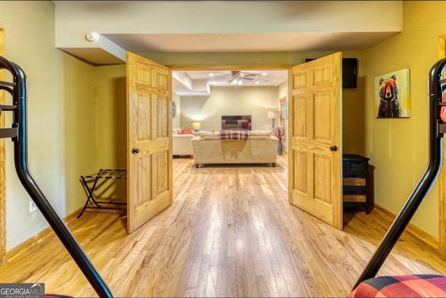 corridor with light wood-type flooring