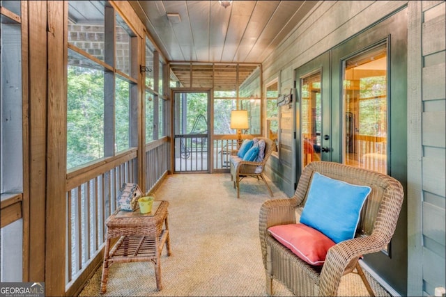 sunroom / solarium with wood ceiling