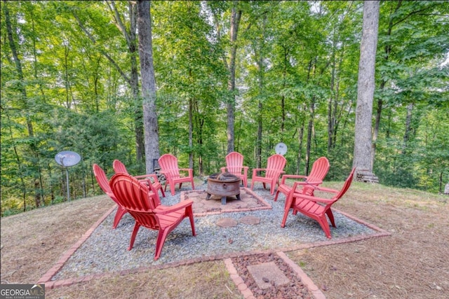 view of patio with a fire pit