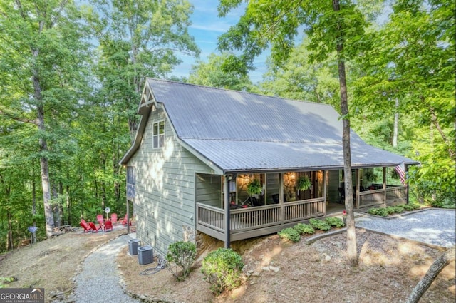 view of front of property with central air condition unit and covered porch