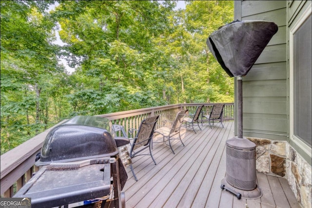 wooden deck with grilling area