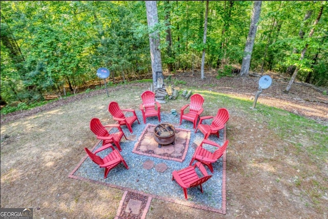 view of yard featuring a patio and a fire pit