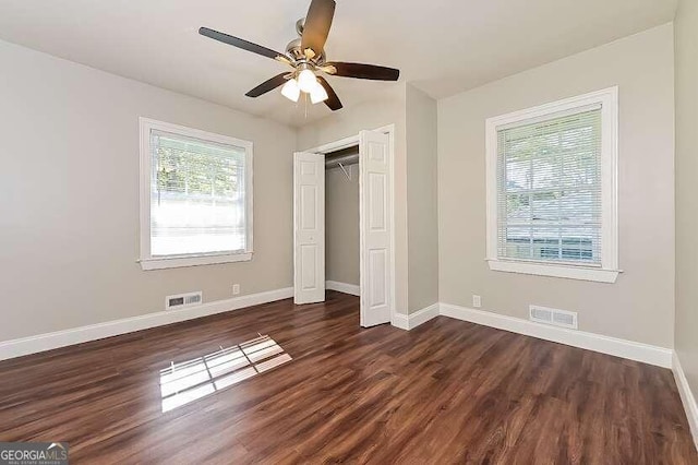 unfurnished bedroom featuring a closet, ceiling fan, and dark hardwood / wood-style floors