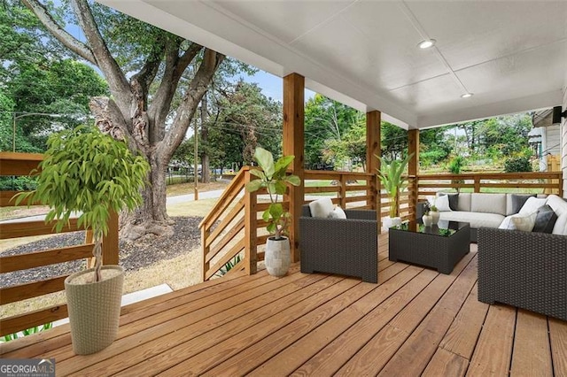 wooden deck featuring outdoor lounge area