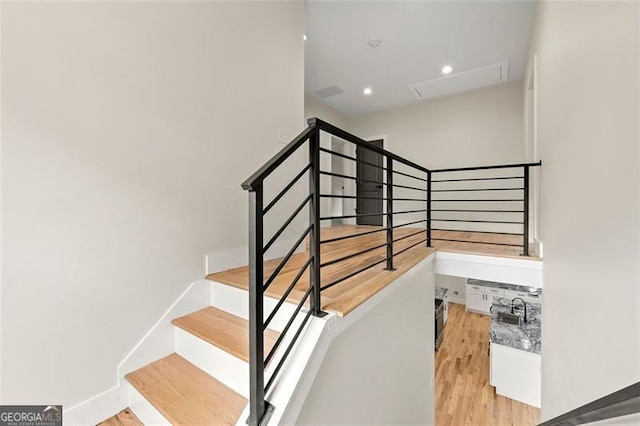 stairway featuring hardwood / wood-style flooring