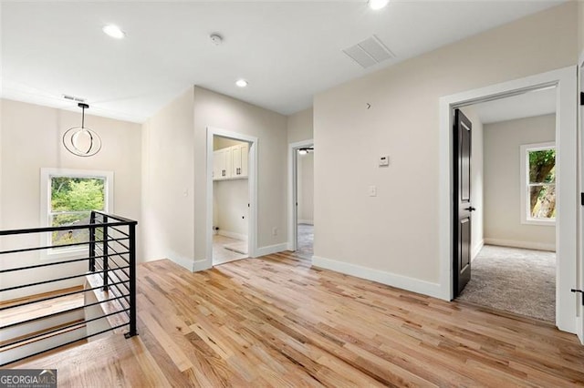 corridor featuring light hardwood / wood-style floors