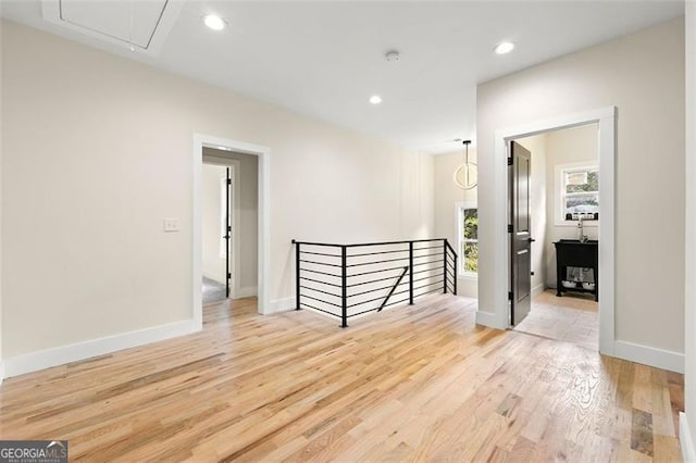 corridor with light wood-type flooring