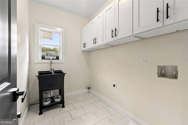 laundry room with hookup for a washing machine, cabinets, and hookup for an electric dryer