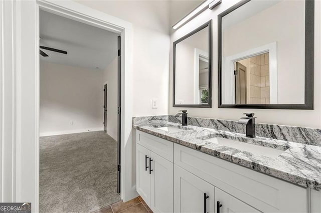 bathroom featuring ceiling fan, vanity, and tile patterned floors