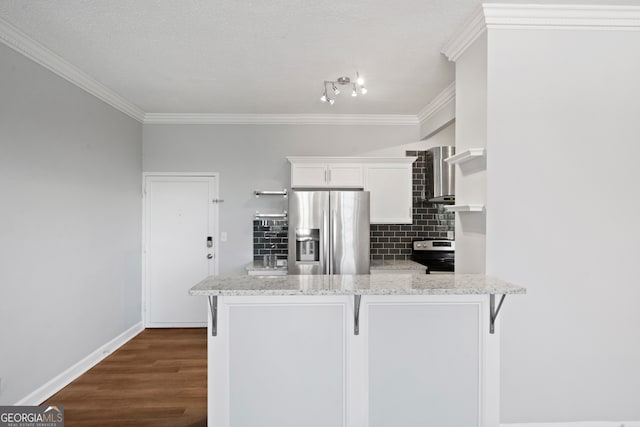 kitchen with white cabinetry, kitchen peninsula, appliances with stainless steel finishes, and dark wood-type flooring