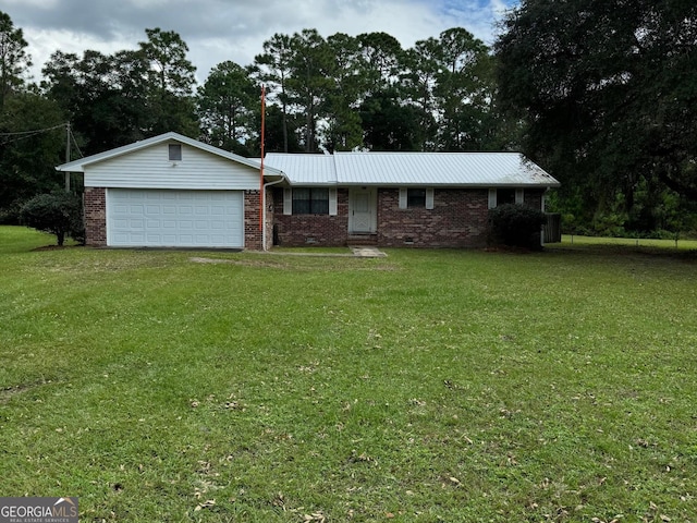 single story home with a garage and a front lawn