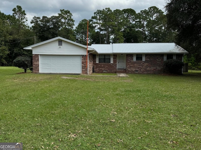 ranch-style house featuring a garage and a front lawn