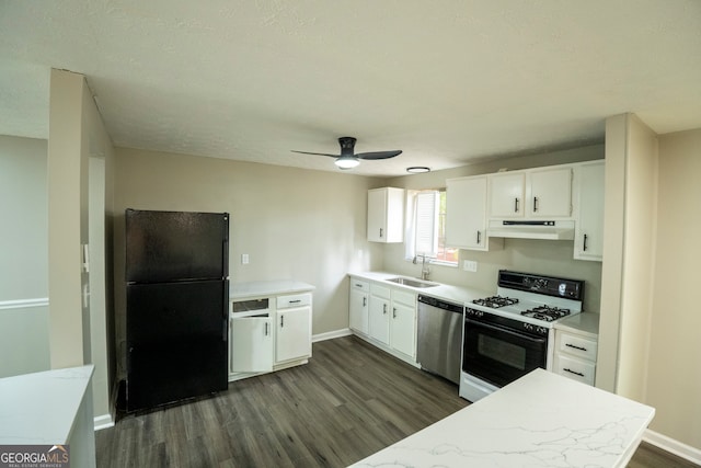 kitchen featuring dishwasher, black refrigerator, white gas range oven, and dark hardwood / wood-style flooring