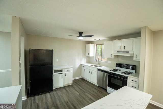 kitchen featuring stainless steel dishwasher, dark hardwood / wood-style floors, gas range gas stove, black refrigerator, and sink