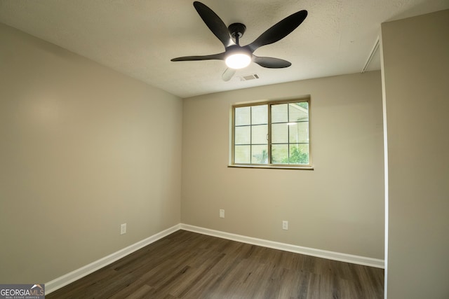 unfurnished room with dark wood-type flooring, a textured ceiling, and ceiling fan