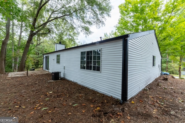 view of side of home featuring central air condition unit