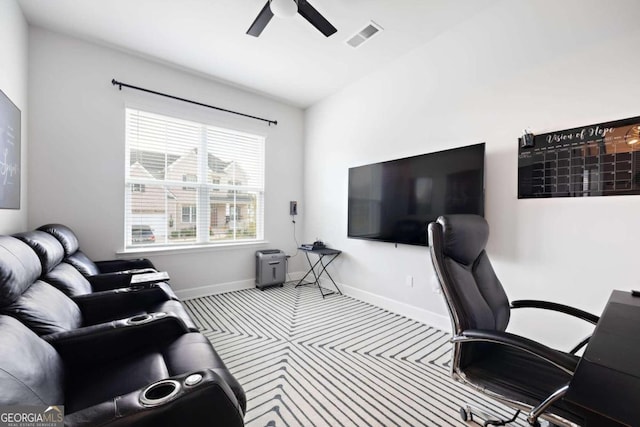 office space with vaulted ceiling, light carpet, and ceiling fan