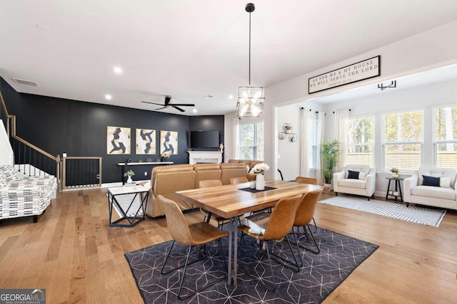 dining room with ceiling fan, hardwood / wood-style floors, and a wealth of natural light