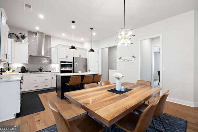 dining space with dark wood-type flooring