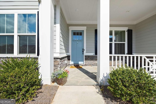 property entrance featuring covered porch