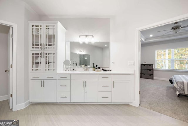 bathroom with ceiling fan and vanity