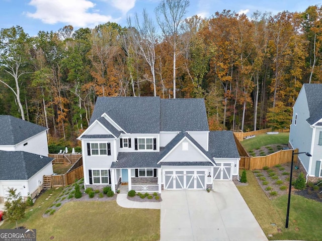 view of front facade featuring a garage and a front lawn