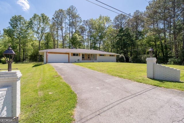 ranch-style house with a garage and a front yard