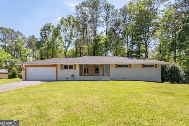 single story home featuring a garage and a front yard