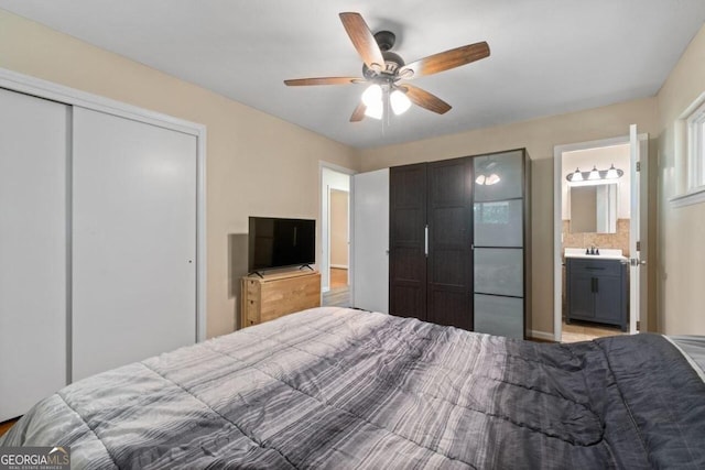 bedroom with ceiling fan and ensuite bathroom