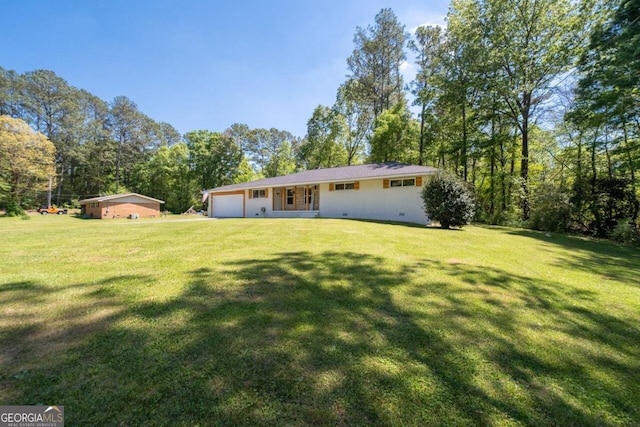 view of yard featuring a garage