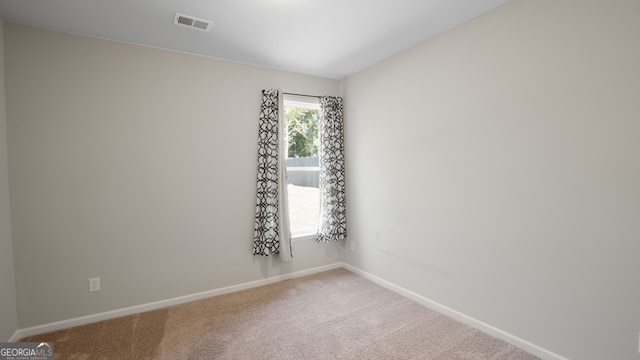 view of carpeted spare room