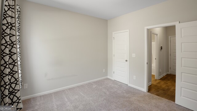 unfurnished bedroom with carpet