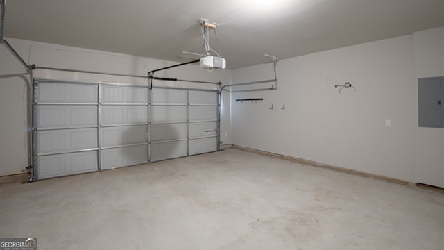 garage with a garage door opener and electric panel