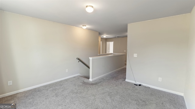 empty room featuring light colored carpet