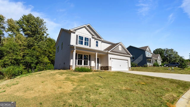 craftsman inspired home featuring a garage, a porch, and a front lawn