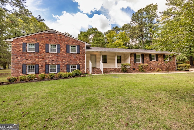 split level home with a front lawn