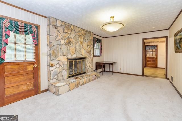 carpeted living room featuring a fireplace and crown molding