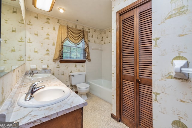 bathroom featuring a bath, crown molding, vanity, and toilet