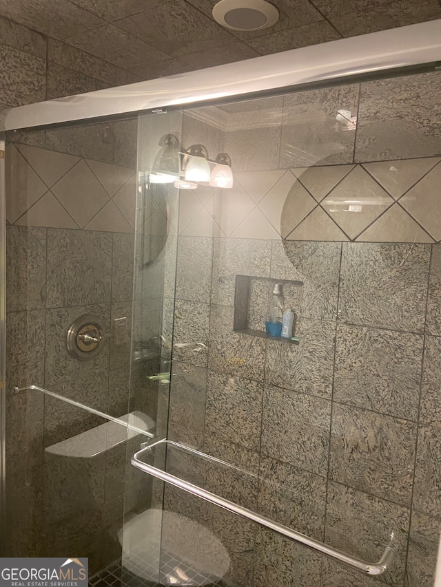 bathroom featuring an enclosed shower