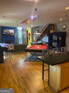 recreation room with light wood-type flooring