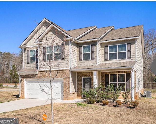 view of front of house featuring central AC and a garage