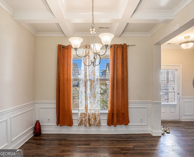 unfurnished dining area featuring coffered ceiling, dark hardwood / wood-style floors, a chandelier, and a healthy amount of sunlight