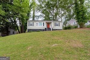 ranch-style home with a front yard