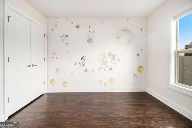 spare room featuring dark hardwood / wood-style flooring