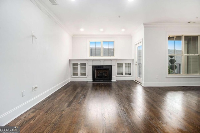 unfurnished living room with ornamental molding and dark hardwood / wood-style floors