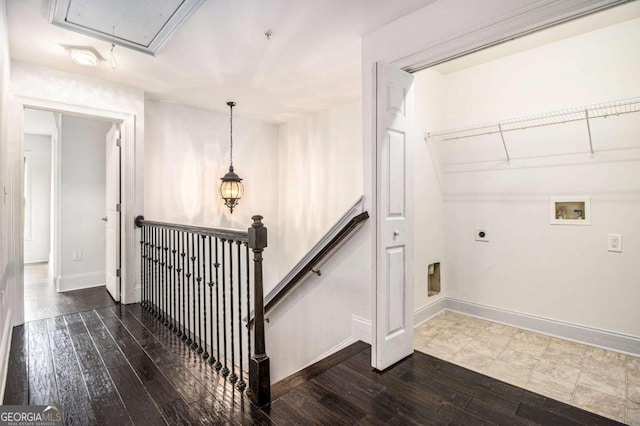 washroom featuring electric dryer hookup, dark hardwood / wood-style floors, and hookup for a washing machine