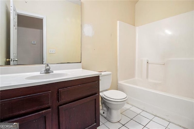 full bathroom with tile patterned flooring, washtub / shower combination, vanity, and toilet