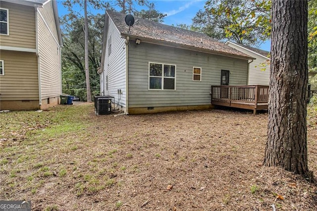 back of house featuring central AC and a deck