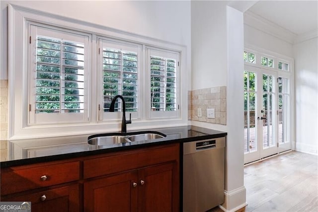 kitchen featuring dishwasher, sink, a wealth of natural light, and french doors