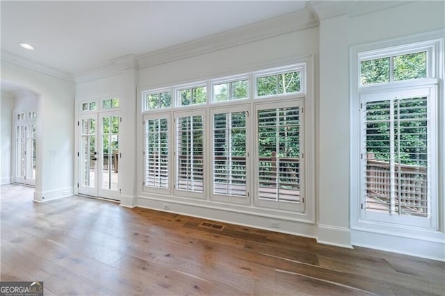 unfurnished sunroom featuring french doors